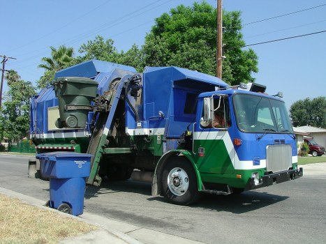 Happy homeowner using a skip for a home renovation project