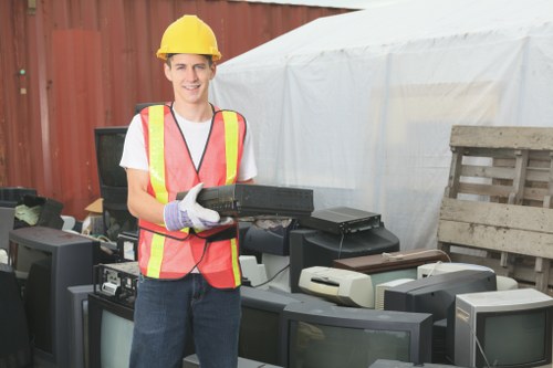 Wide view of a grab hire container placed at a commercial construction site.