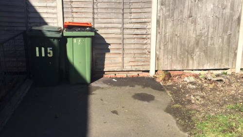 A skip being delivered to a residential property in Stratford